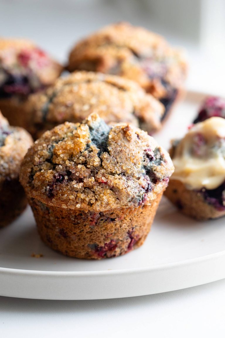 Mixed Berry Muffins on a serving plate.