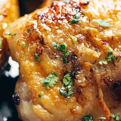 Honey Lemon Chicken in a cast iron pan.