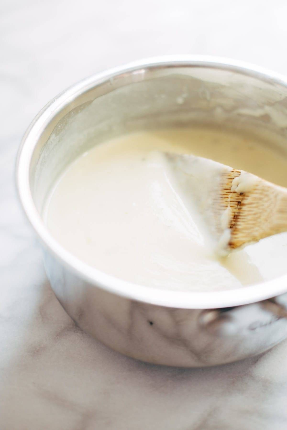 Spicy Lentil Nachos with Three Cheese Sauce - you will not believe how good these are! Saucy filling with a velvety homemade cheese sauce. Vegetarian. | pinchofyum.com