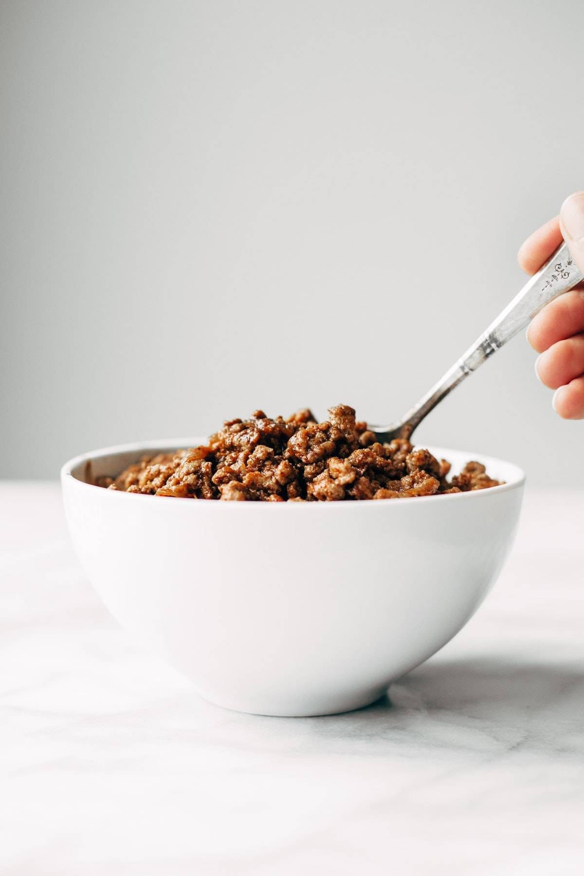 Creamy Pumpkin Spaghetti with Garlic Kale - this is the most crazy good combination! Spicy turkey, creamy pumpkin sauce, and pasta! | pinchofyum.com