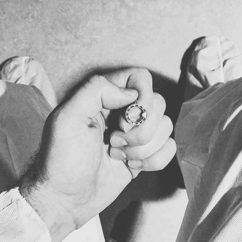 Bjork holding a necklace.