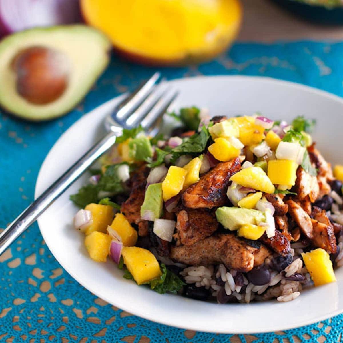 Caribbean jerk salmon bowl with mango salsa.