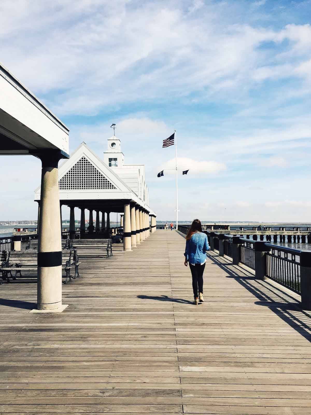 Woman walking down the boardwalk.